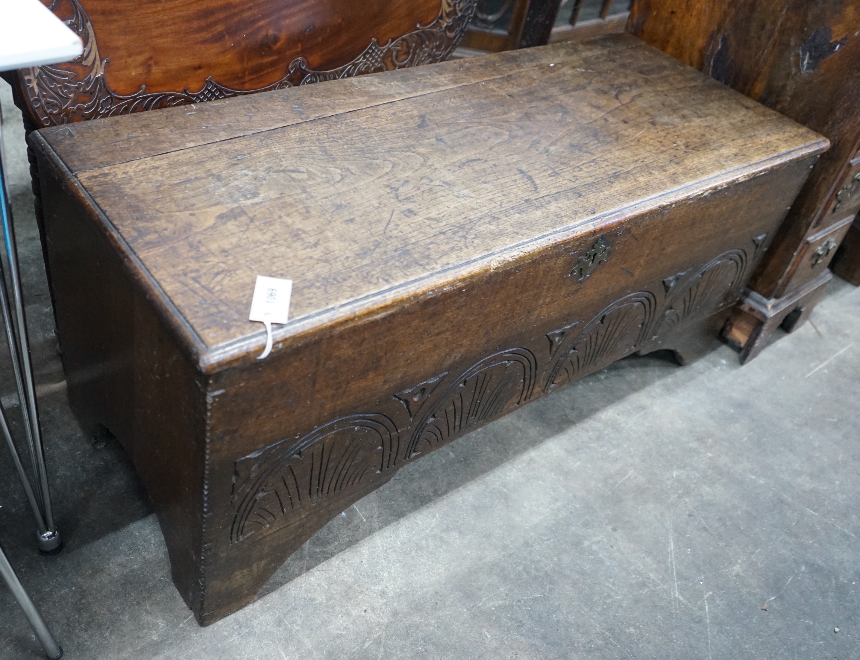 A late 17th / early 18th century carved six plank oak coffer width 115cms, depth 44cms, height 50cms.